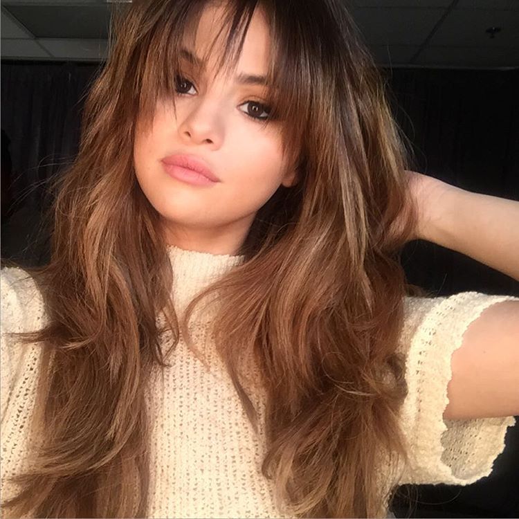 Selena Gomez cream knit top photo Chris Classen