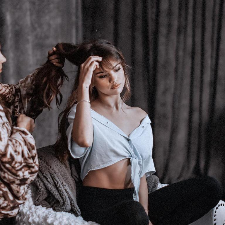 Selena Gomez having her hair done blur tie front top photo louise
