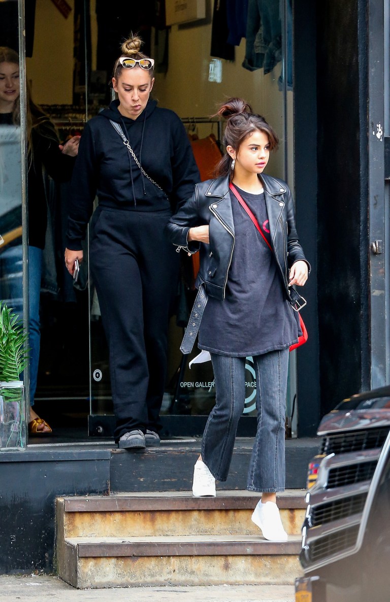 Selena Gomez black leather biker jacket jeans white sneakers trainers red bag New York September 2017 Selena Goemz street style