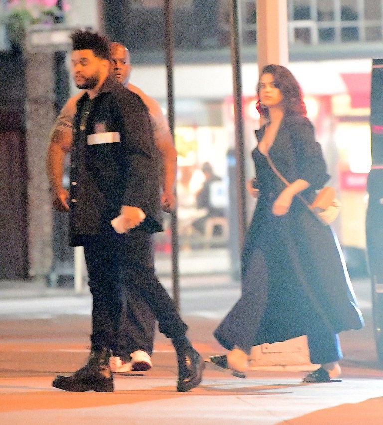 Selena Gomez style black outfit white bag with The Weeknd New York September 2017