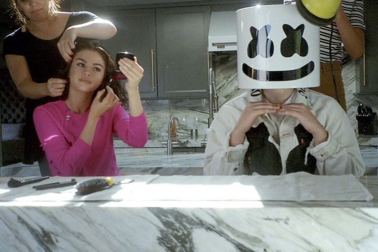 Selena Gomez pink sweater wolves video