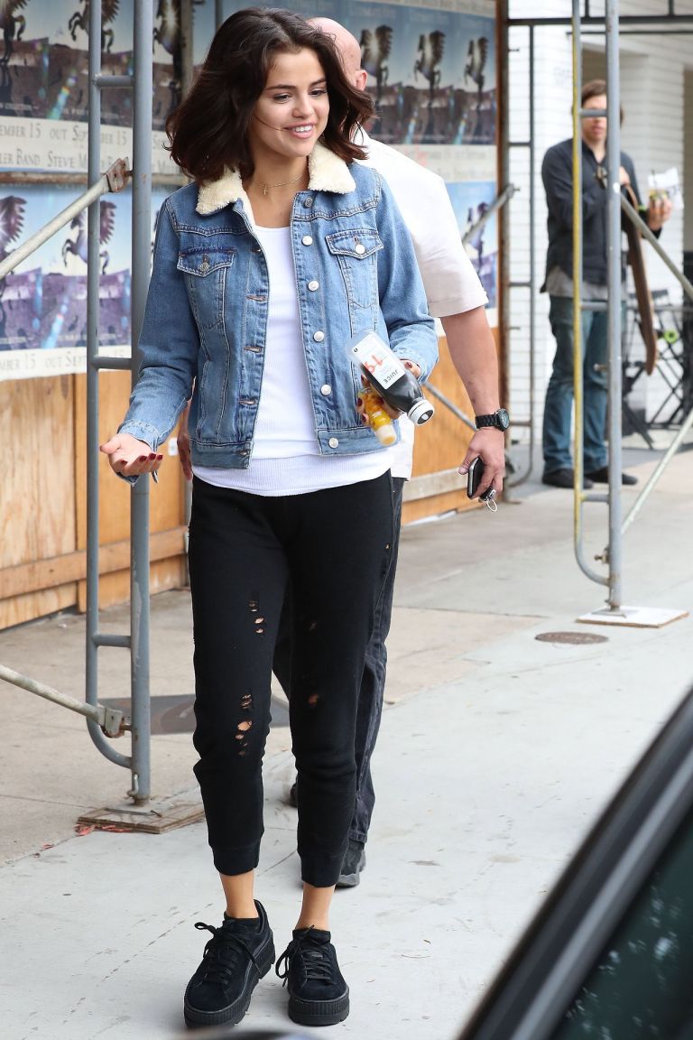 Selena Gomez style blue denim jacket fluffy collar black trainers 2 November 2017