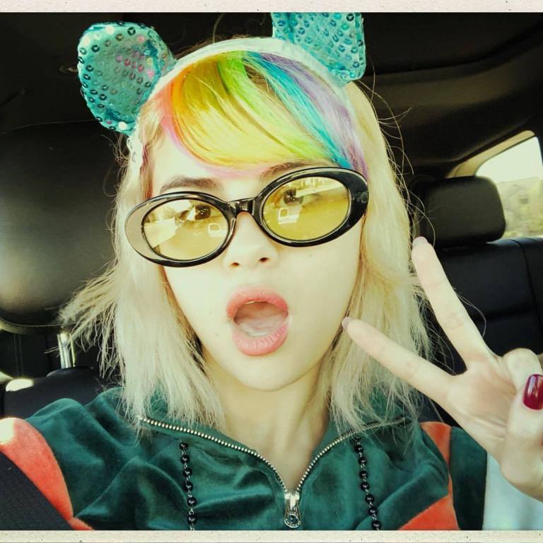 Selena gomez style green velour tracksuit yellow sunglassesNovember 2017