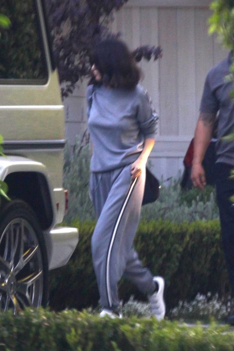 Selena Gomez style grey sweatsuit black and white stripes 22 October 2017