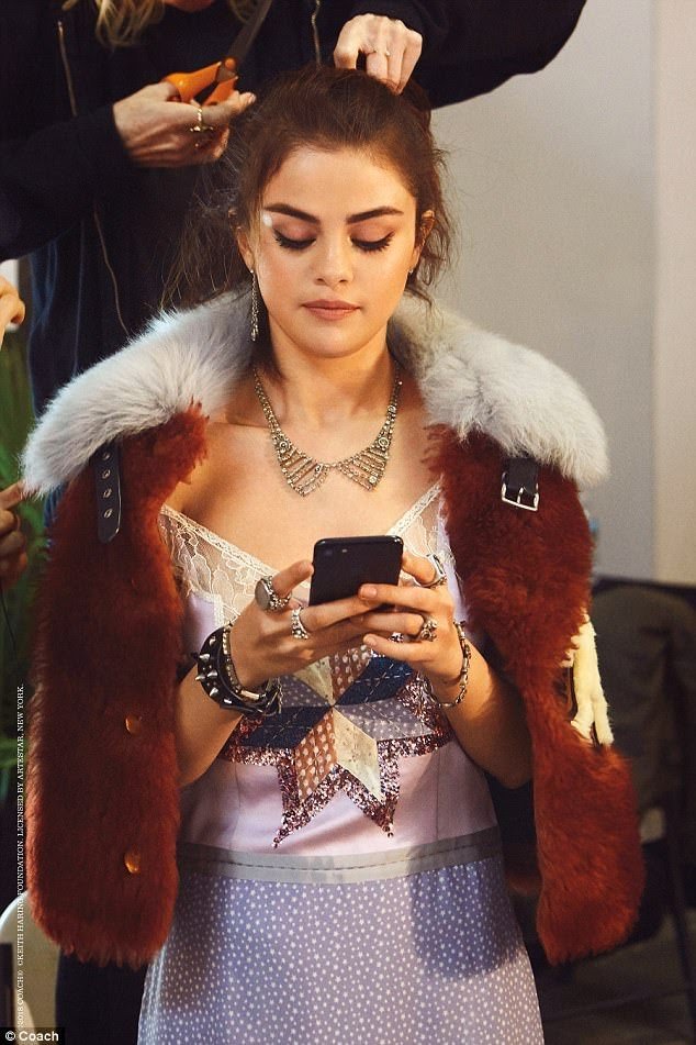 Selena Gomez style lilac dress tan fur jacket Coach SS18