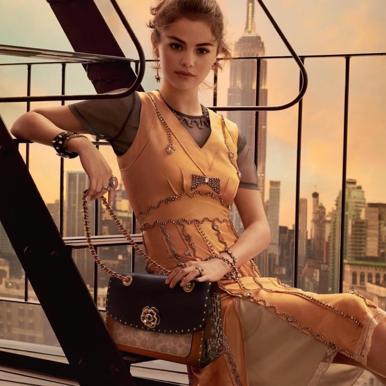 Selena Gomez style peach satin dress rosette bag Coach SS18