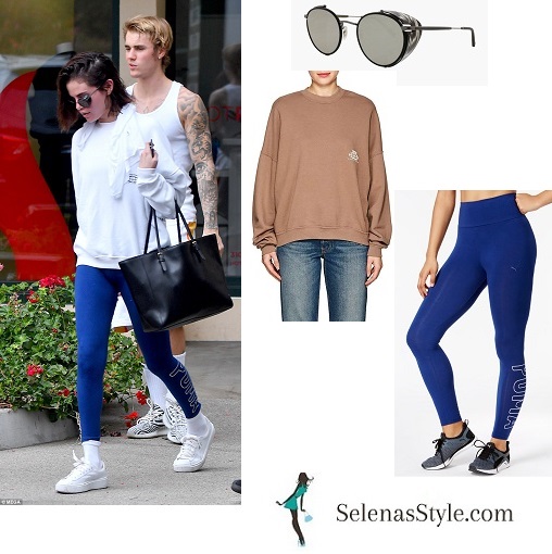 Selena Gomez style white sweatshirt blue Puma leggings white sneakers black bag with Justin Bieber 3 January 2018