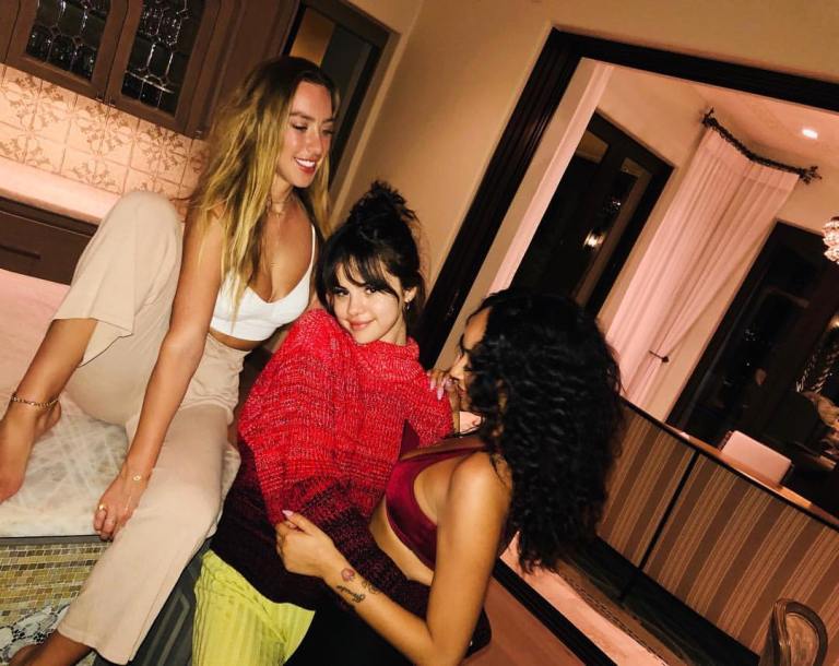 Selena Gomez style clothes fashion red lace top yellow ribbed trousers February 2018