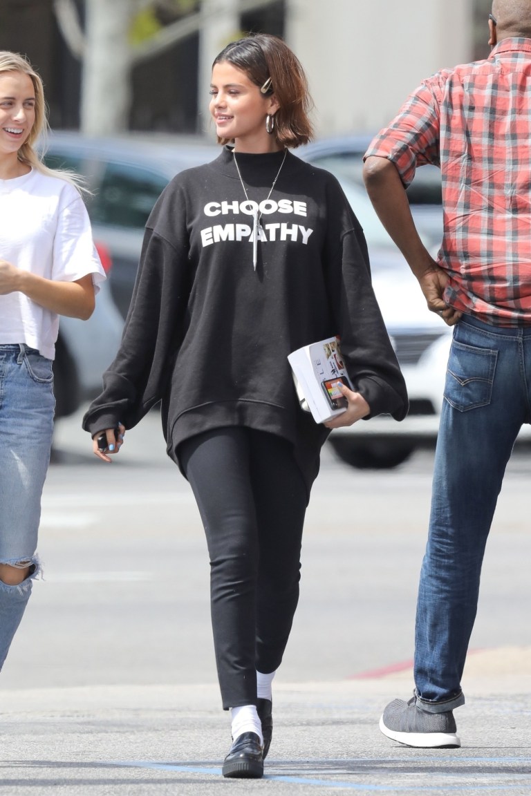Selena gomez style clothes outfit choose empathy sweatshirt silver hoop earrings black loafer MArch 25 2018