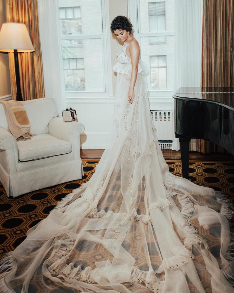 Selena Gomez style pale pink chiffon gown with train by Stuart Vevers Met Gala 2018