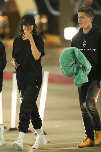Selena gomez style blog black t-shirt black puma sweatpants white sneakers 26 July 2018