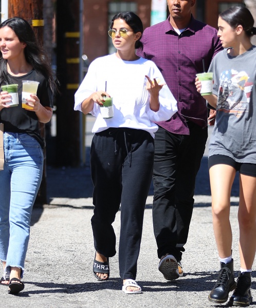 Selena gomez style blog white sweatshirt black jogging pants black and white slides September 2018