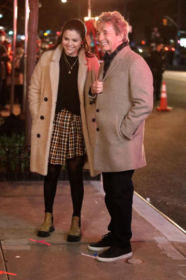 where to get Selena Gomez white yellow pleated check skirt green boots teddy coat MArch 31 2021 Photo Getty Images