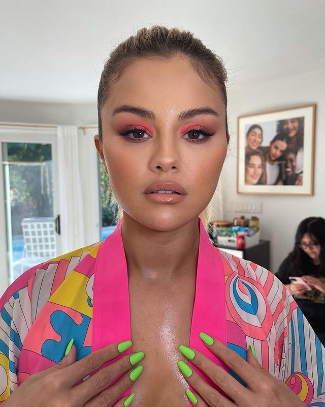 Where to get Selena Gomez outfits June 2021 blog bright pink blue white robe to tease her new swimwear collection
