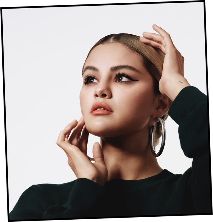 where to get Selena Gomez Rare Beauty black sweatshirt silver hoops 26 August 2021 Photo Rare Beauty