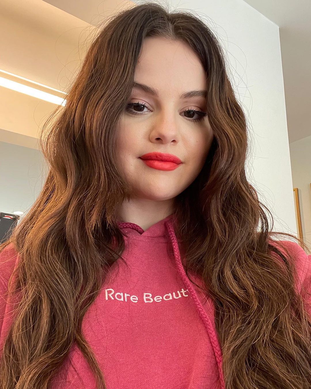 where to get Selena Gomez pink Rare Beauty Hoodie September 2021 Photo Rare Beauty