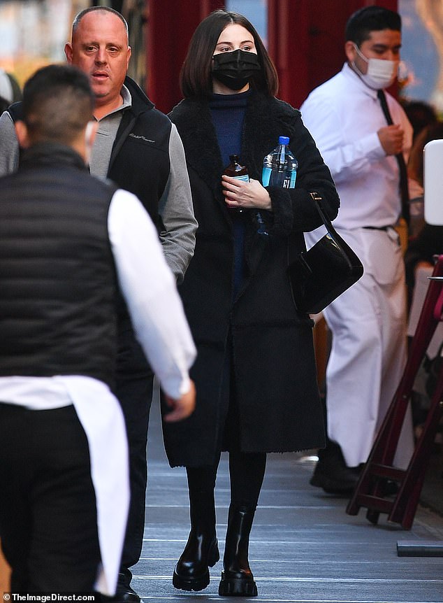 where to get Selena Gomez black shearling coat black boots black patent bag New york 11 november 2021 Photo TheImagedirect com